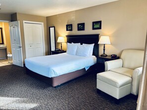 Premium bedding, desk, laptop workspace, blackout curtains