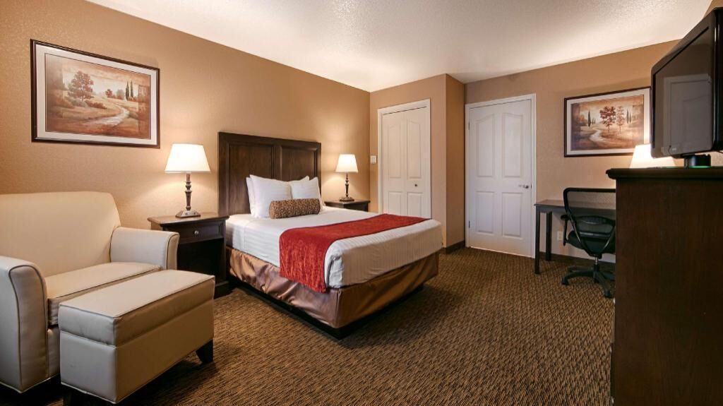 Premium bedding, desk, laptop workspace, blackout drapes