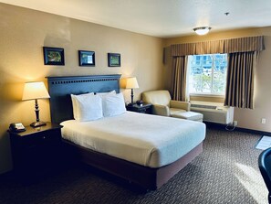 Premium bedding, desk, laptop workspace, blackout curtains