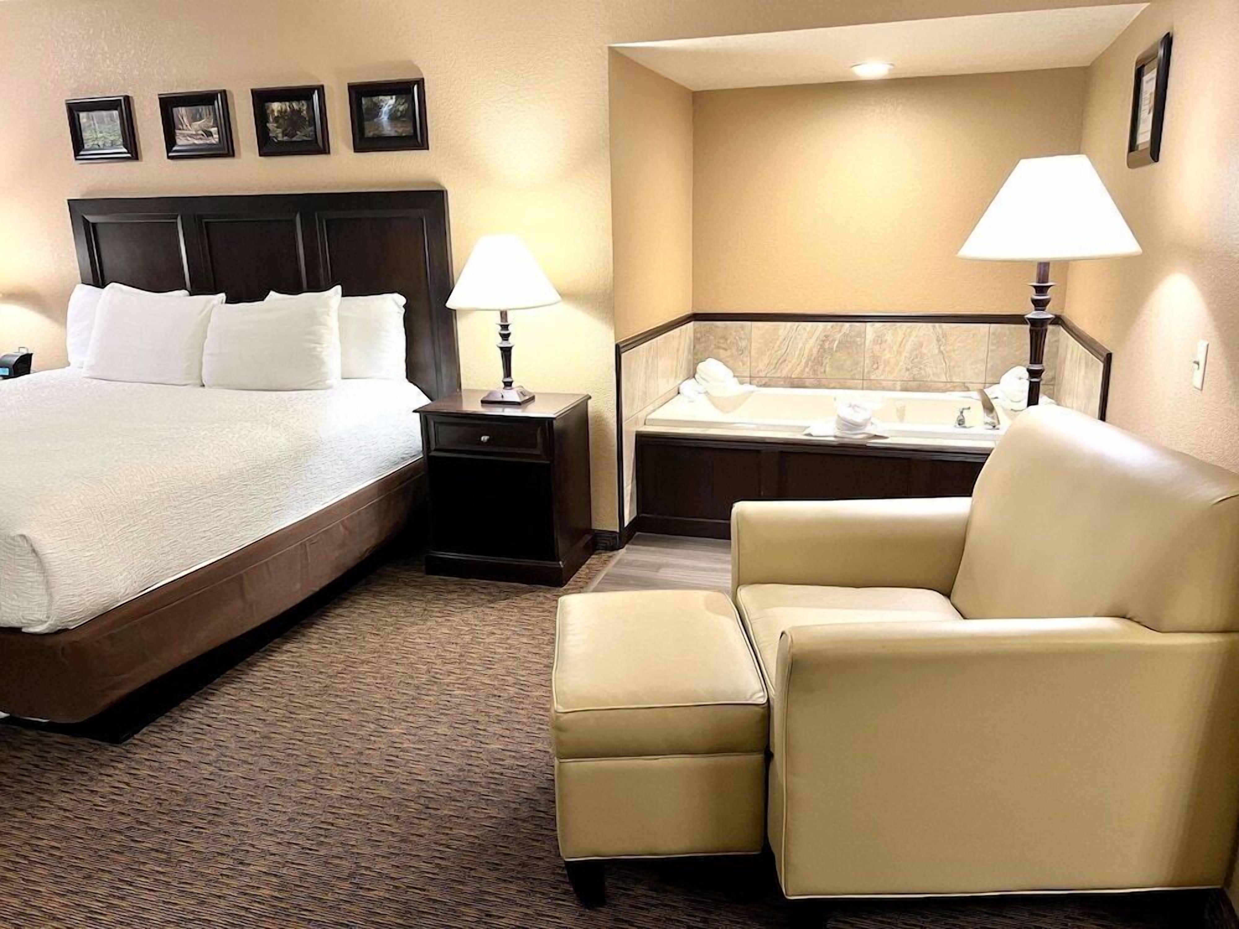 Premium bedding, desk, laptop workspace, blackout drapes