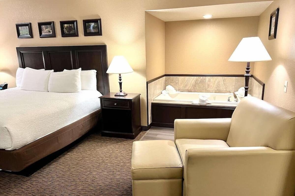 Premium bedding, desk, laptop workspace, blackout drapes