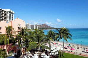 Enjoy stunning ocean views and a mountain backdrop from your balcony, with access to the pool and beach amenities.
