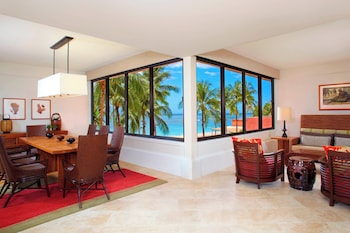 Prestige Oceanfront Suite, 1 Bedroom, 1 King + Sofa bed | Living room | 55-inch flat-screen TV with cable channels, TV at The Royal Hawaiian, a Luxury Collection Resort, Waikiki