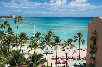 Hotel room view looking out at The Royal Hawaiian, a Luxury Collection Resort, Waikiki