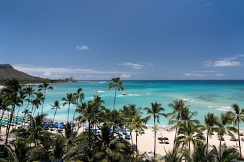 Hotel room view looking out at The Royal Hawaiian, a Luxury Collection Resort, Waikiki