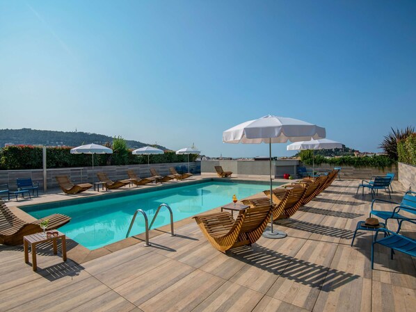 Outdoor pool, open 9:00 AM to 9:00 PM, pool umbrellas, sun loungers