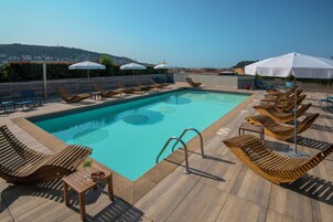 Outdoor pool, open 9:00 AM to 9:00 PM, pool umbrellas, sun loungers