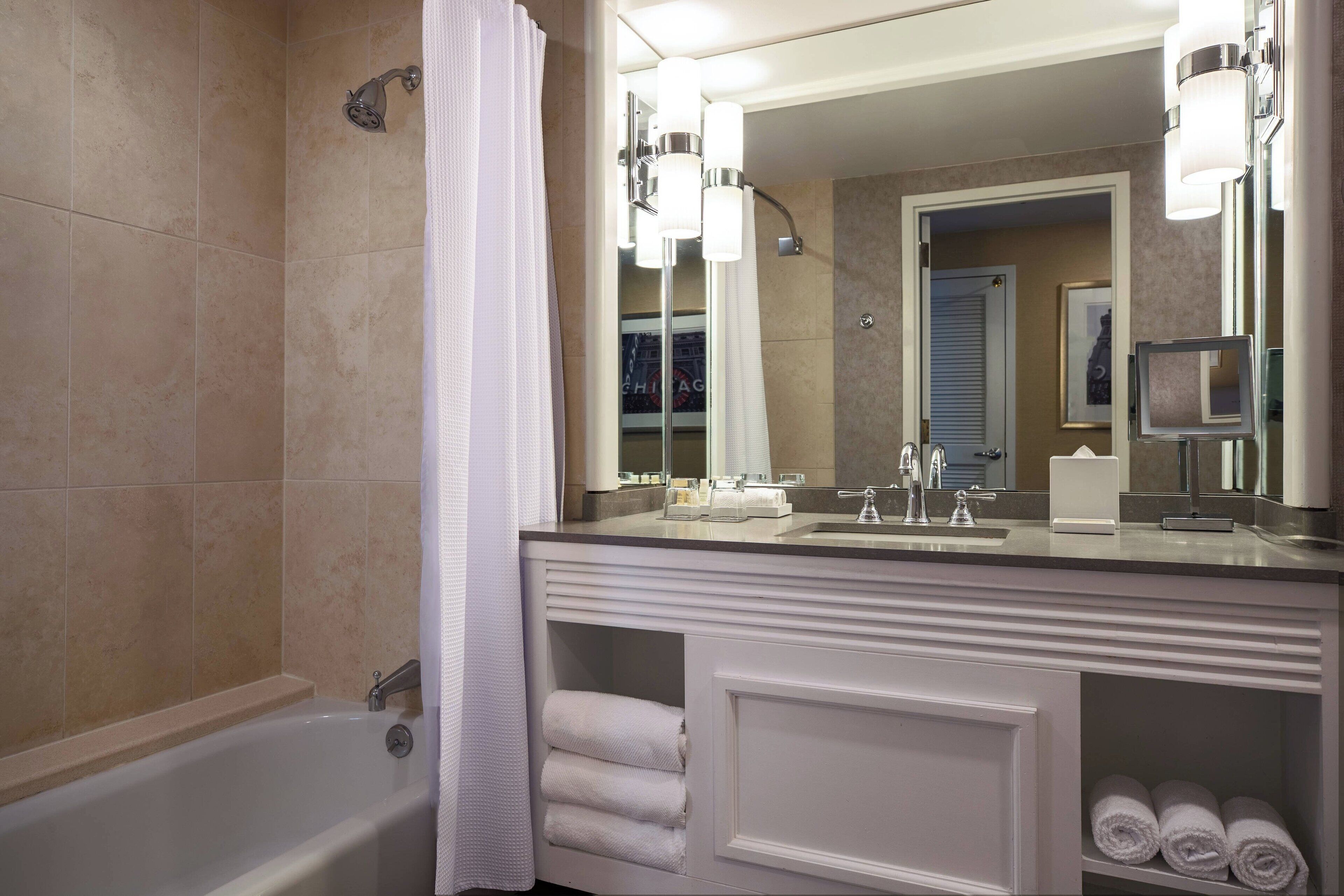 Combined shower/tub, designer toiletries, hair dryer, towels