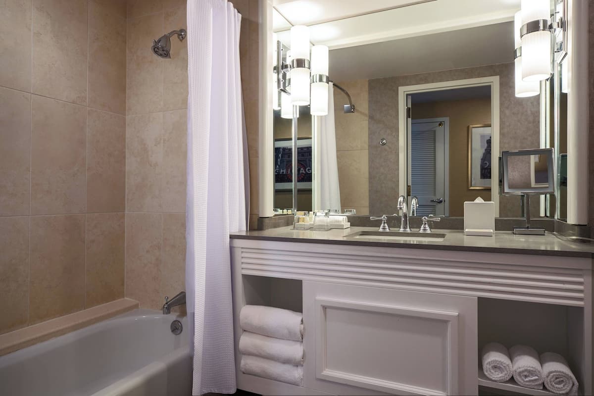 Combined shower/tub, designer toiletries, hair dryer, towels