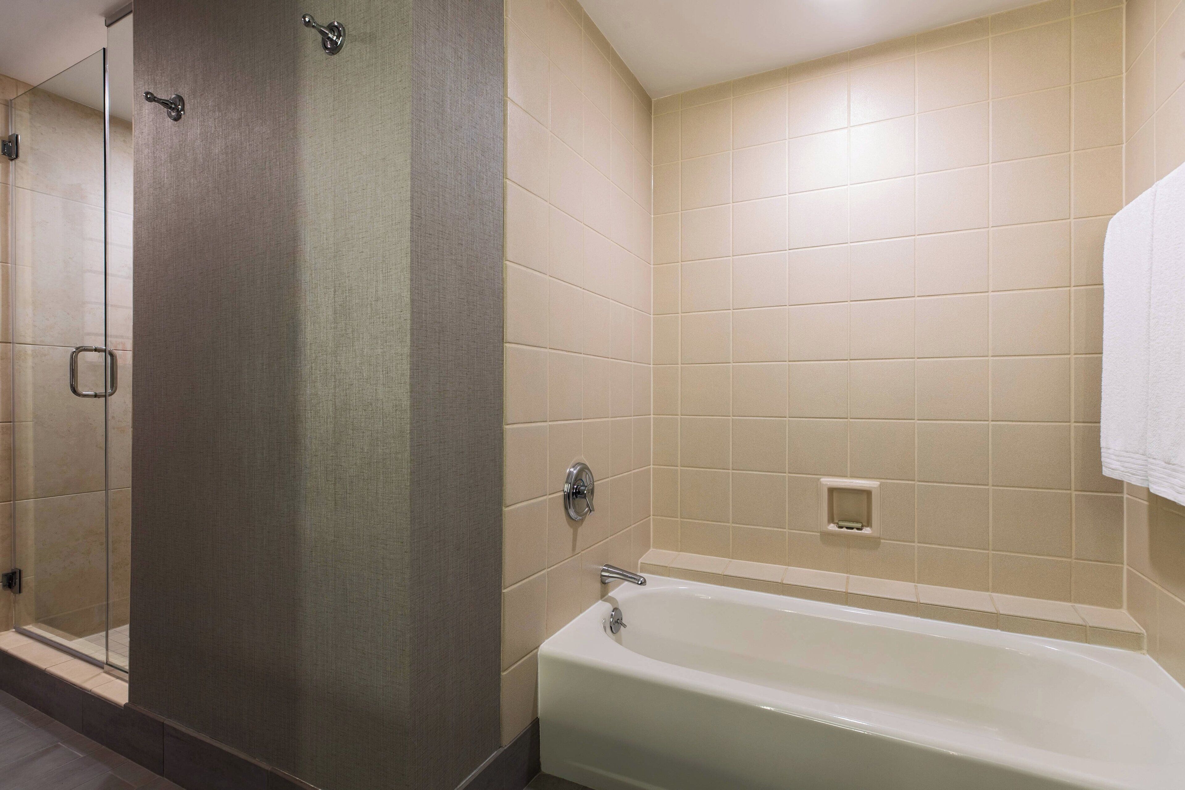 Combined shower/tub, designer toiletries, hair dryer, towels