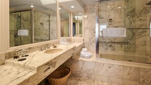 Combined shower/tub, designer toiletries, hair dryer, bathrobes