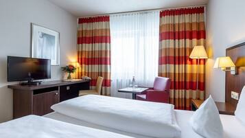 Queen Plus Room | Hypo-allergenic bedding, desk, blackout curtains, soundproofing