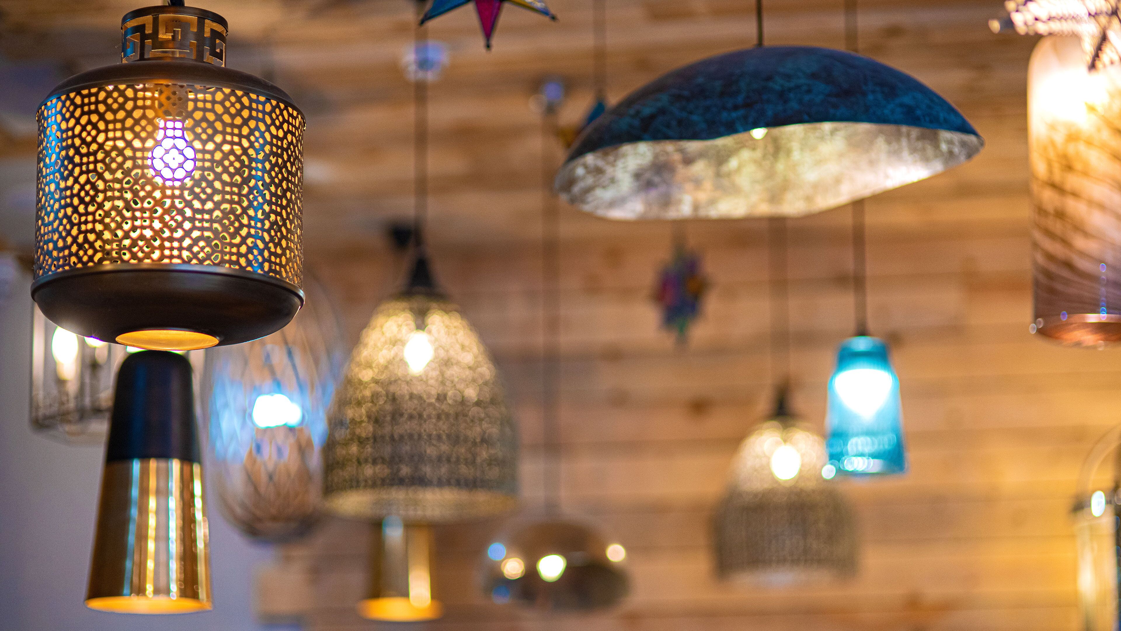A variety of hanging pendant lights with intricate designs.