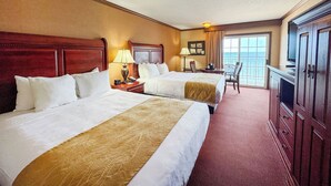 A hotel room with two beds, a desk, a chair, and a television. - Comfort Inn Lakeside (Mackinaw City)