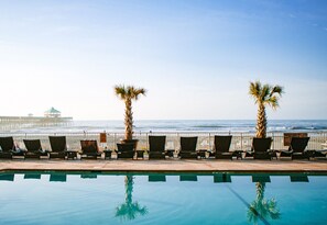 Outdoor pool, a heated pool, pool umbrellas, pool loungers