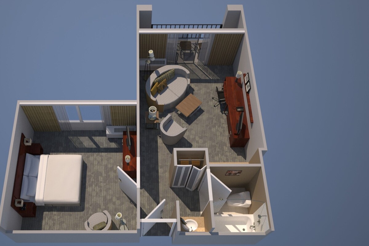 Een 2D plattegrond van een hotelkamer met een bed, een zithoek met een tafel en stoelen, een kleine badkamer en een balkon met uitzicht.