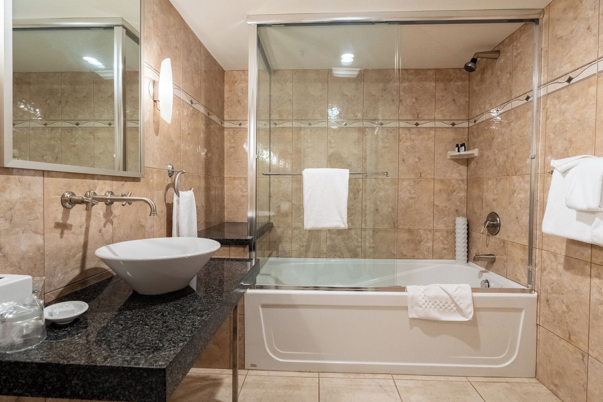 deluxe studio suite (top floor with premium amenities) | bathroom | combined shower/bathtub, free toiletries, hair dryer, bathrobes