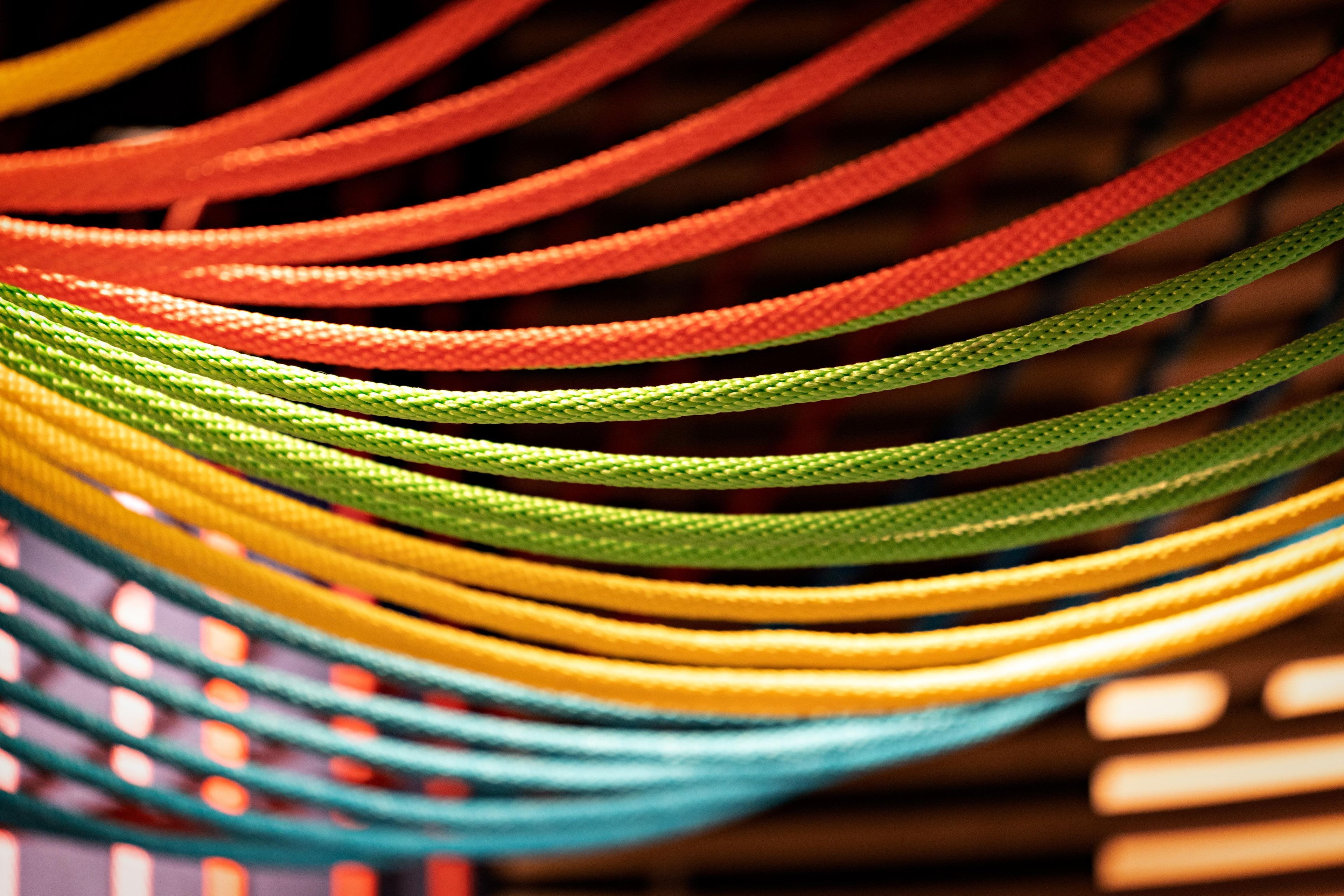 A close-up of multiple colorful ropes or cables.