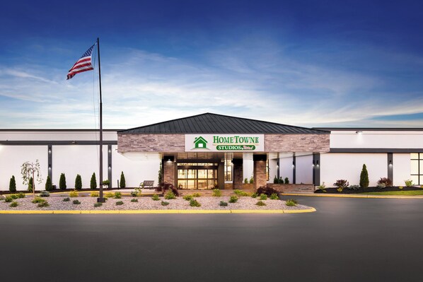 A modern building with a sign reading "HomeTowne Studios."