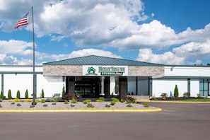 A modern building with a sign reading "HOMETOWNIE STUDIOS."