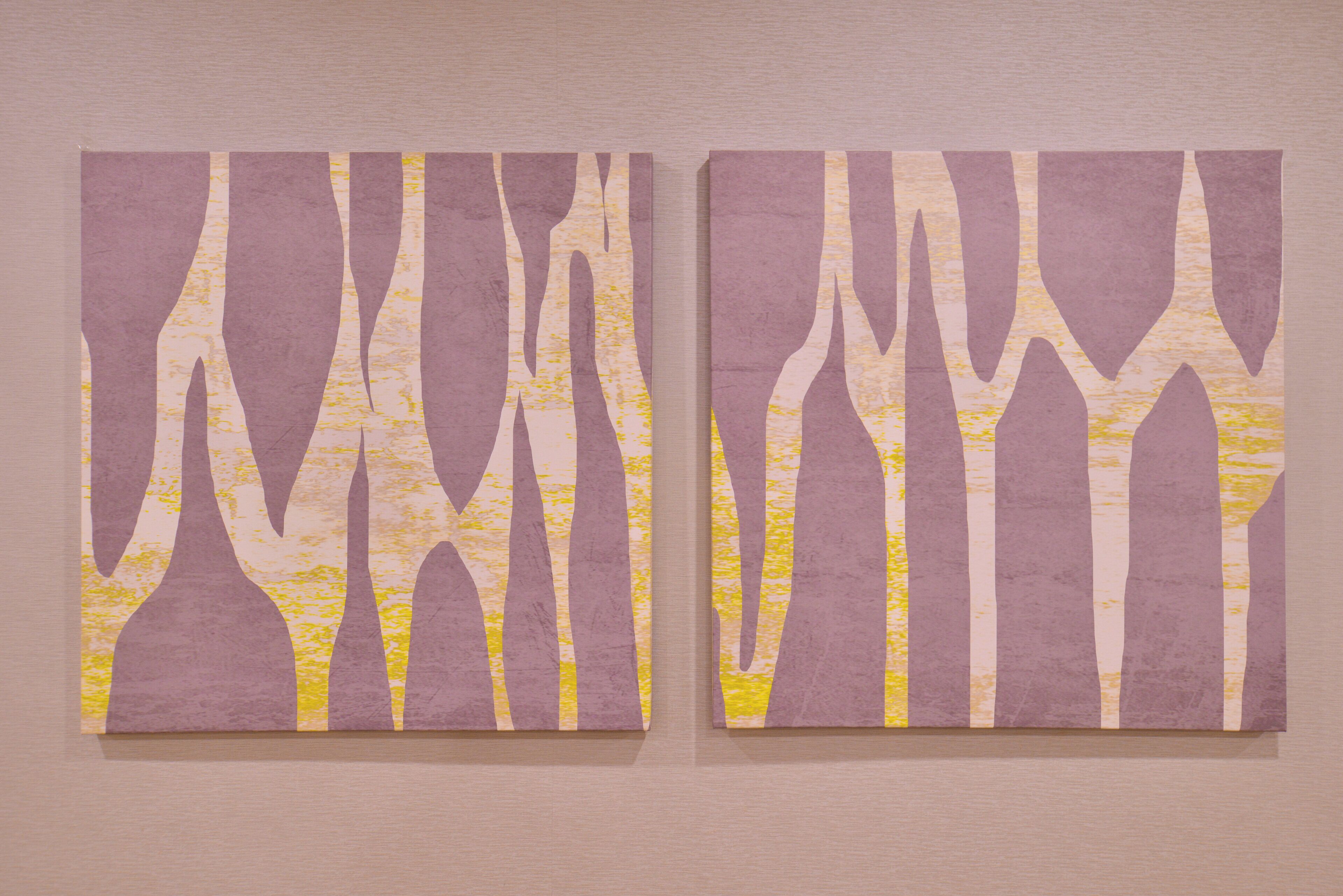 Two wall-mounted artworks with abstract tree-like patterns.