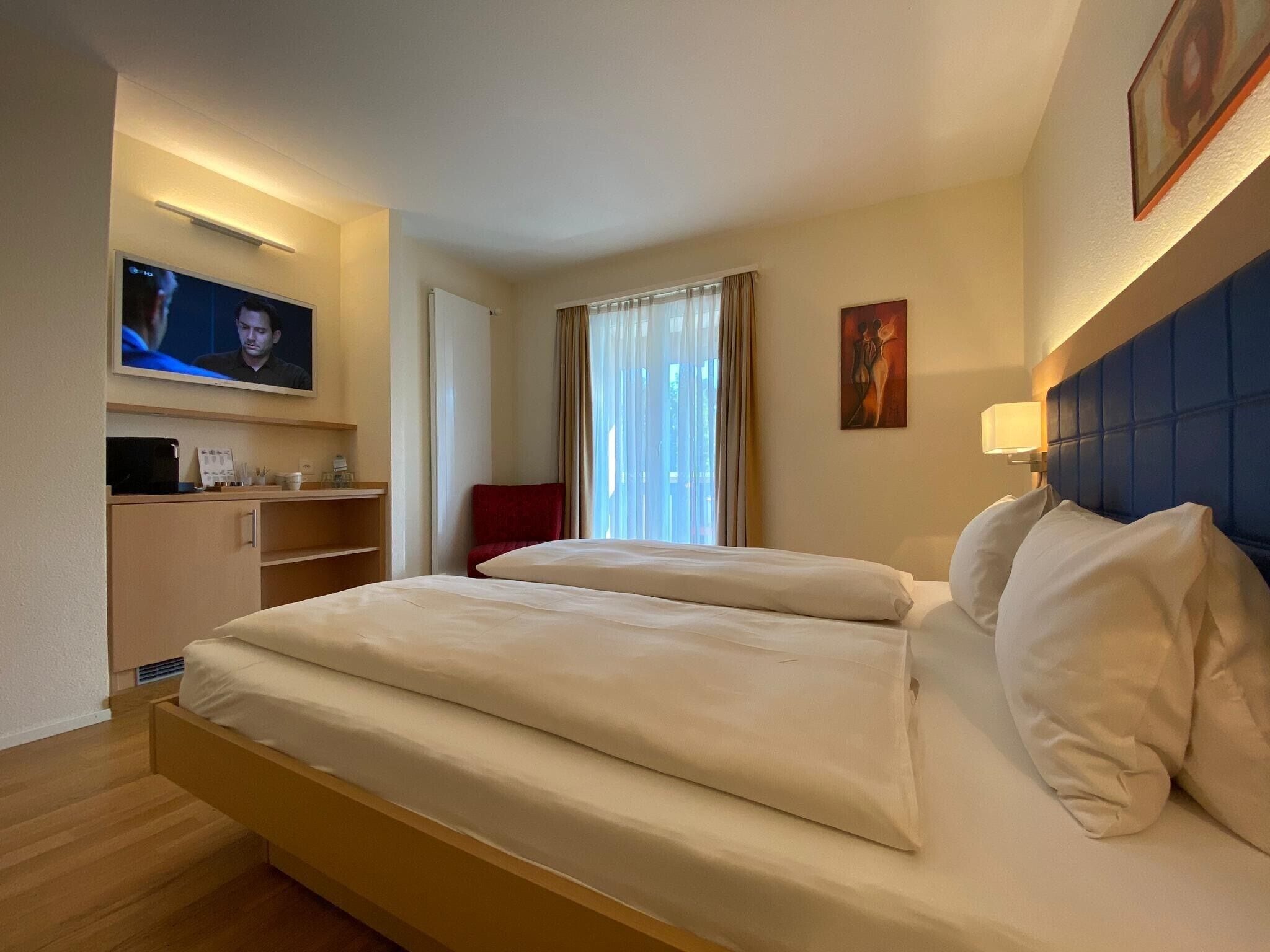 standard double room | in-room safe, desk, blackout curtains, iron/ironing board