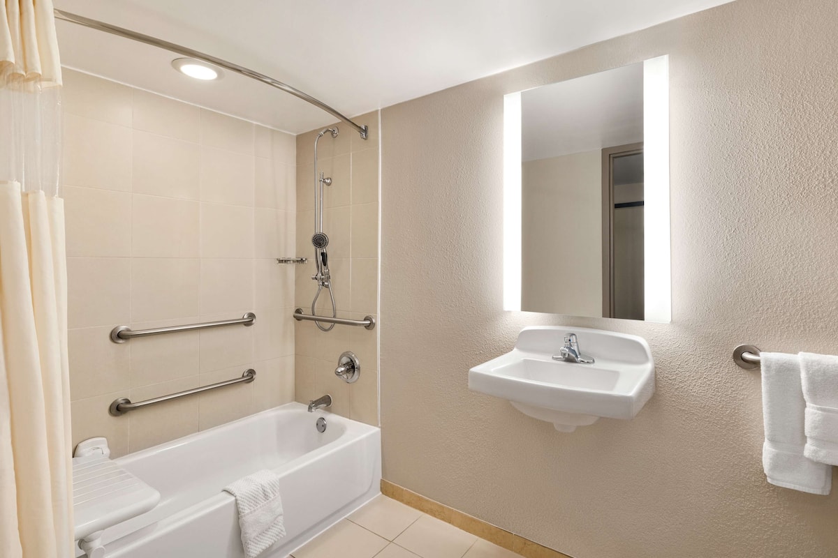 one king bed, non-smoking, accessible | bathroom | combined shower/bathtub, designer toiletries, hair dryer, bathrobes