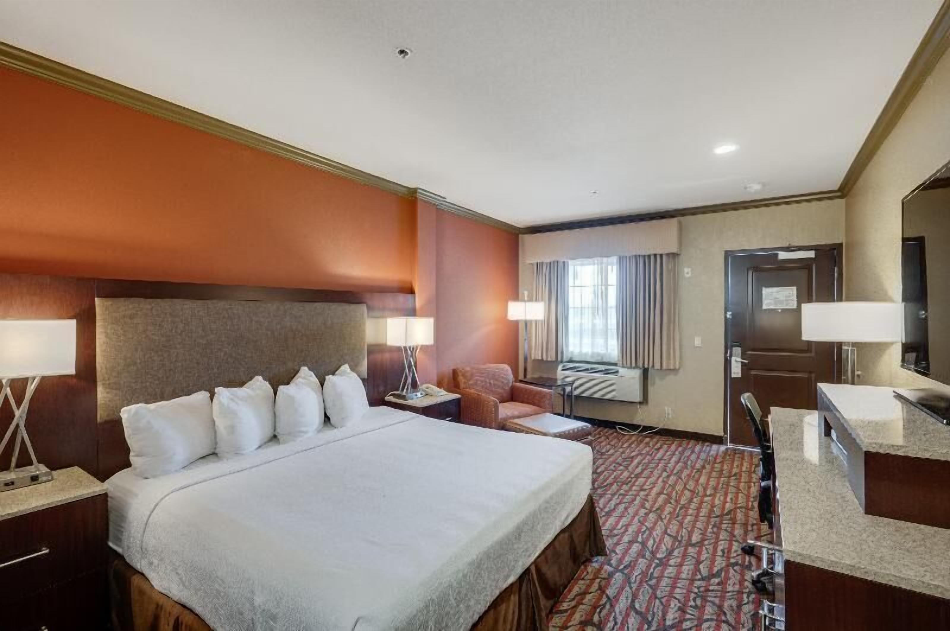 Premium bedding, desk, laptop workspace, iron/ironing board