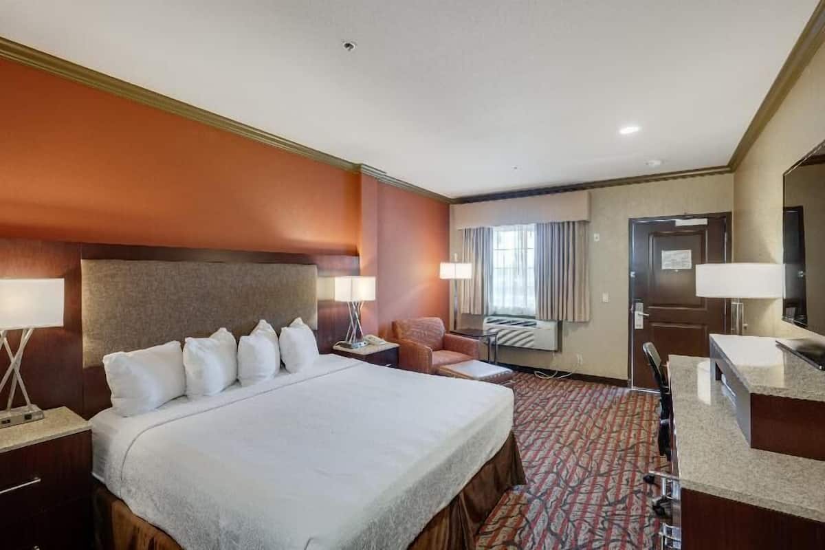 Premium bedding, desk, laptop workspace, iron/ironing board