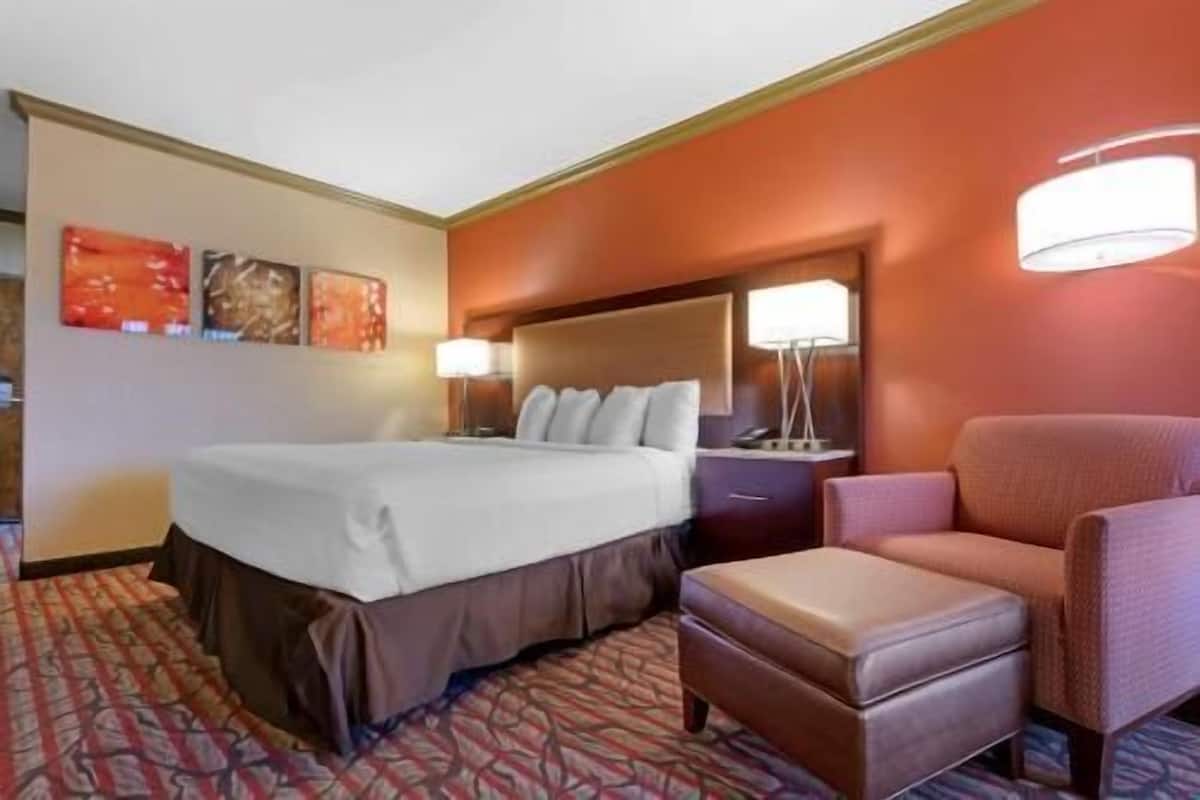 Premium bedding, desk, laptop workspace, iron/ironing board