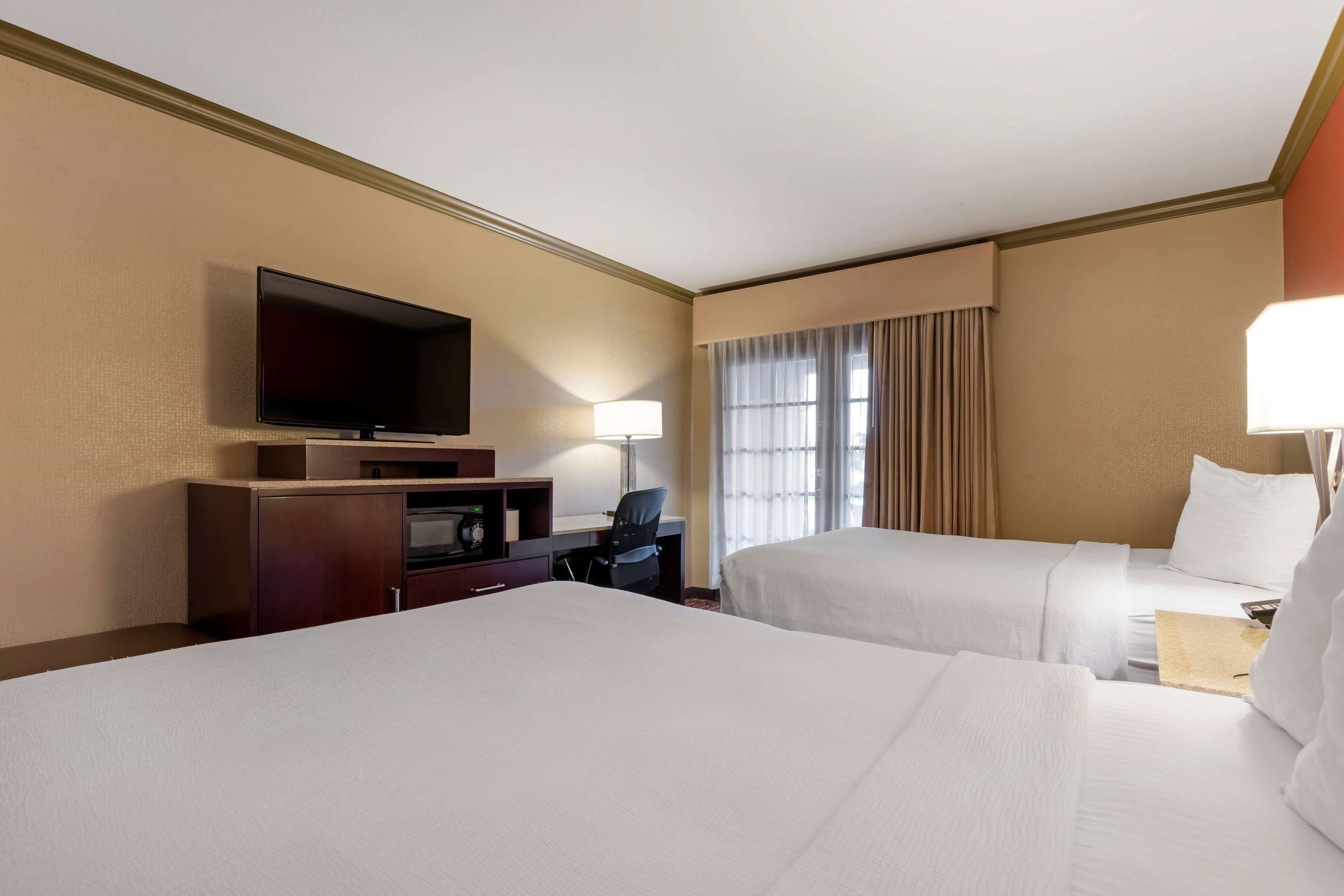 standard room, 2 queen beds, non smoking, refrigerator & microwave | premium bedding, desk, laptop workspace, iron/ironing board