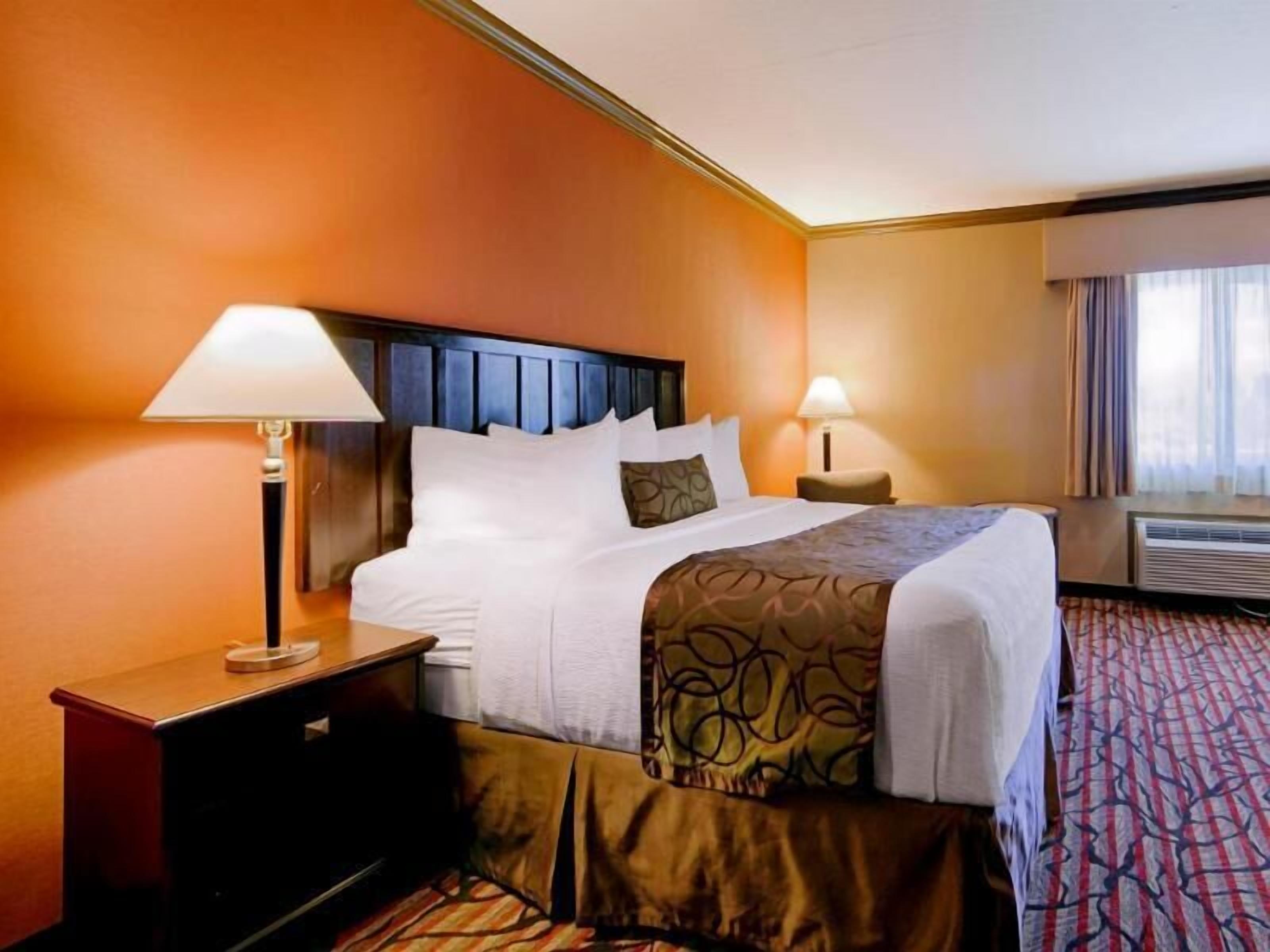 Premium bedding, desk, laptop workspace, iron/ironing board
