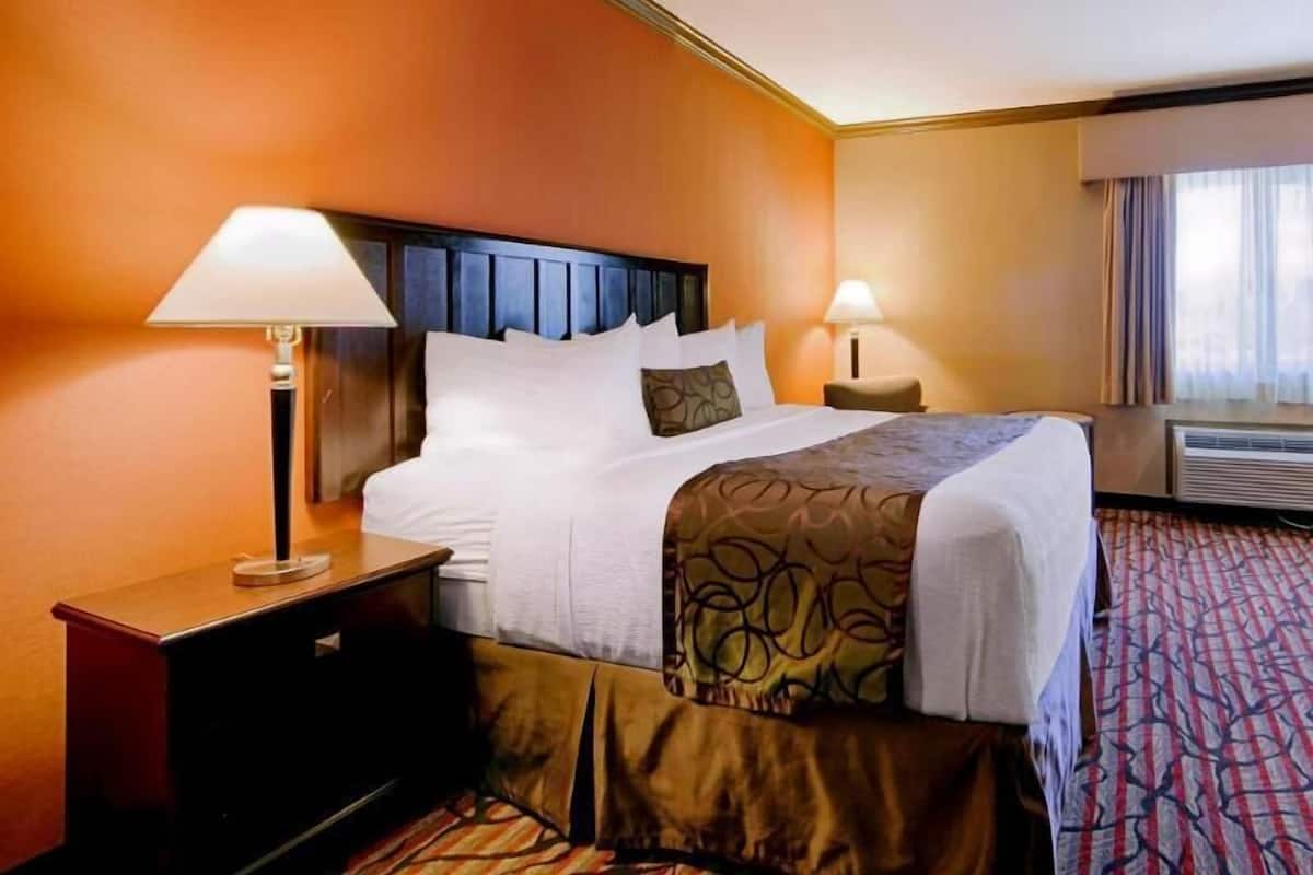 Premium bedding, desk, laptop workspace, iron/ironing board