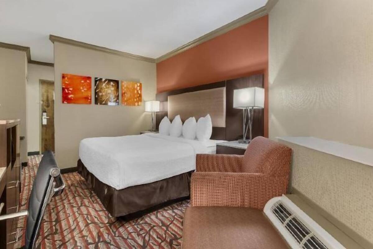 Premium bedding, desk, laptop workspace, iron/ironing board