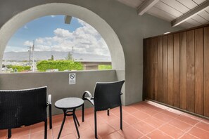 Premium bedding, desk, laptop workspace, iron/ironing board