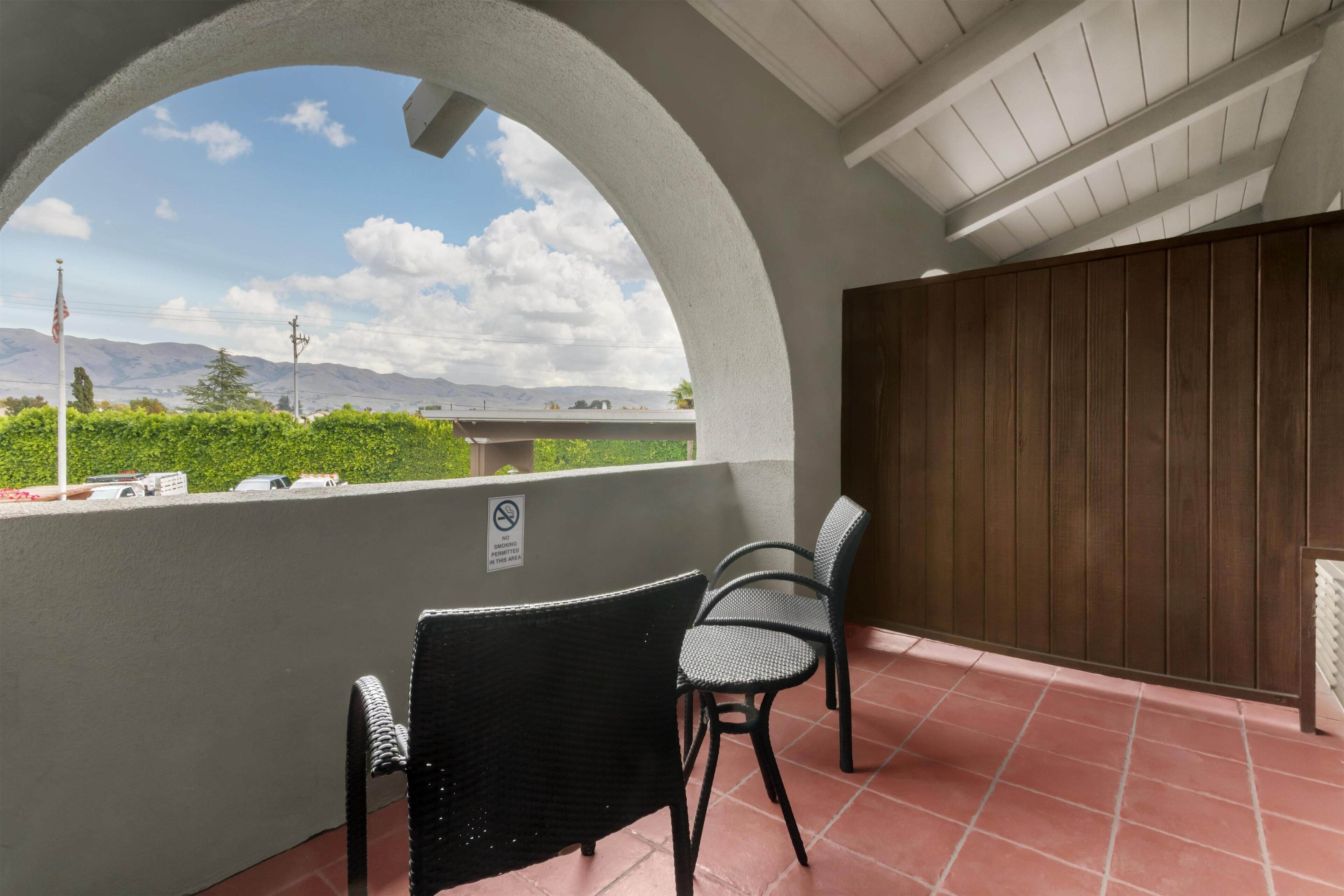 Premium bedding, desk, laptop workspace, iron/ironing board