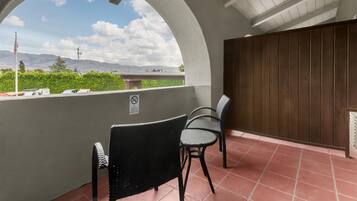 Premium bedding, desk, laptop workspace, iron/ironing board