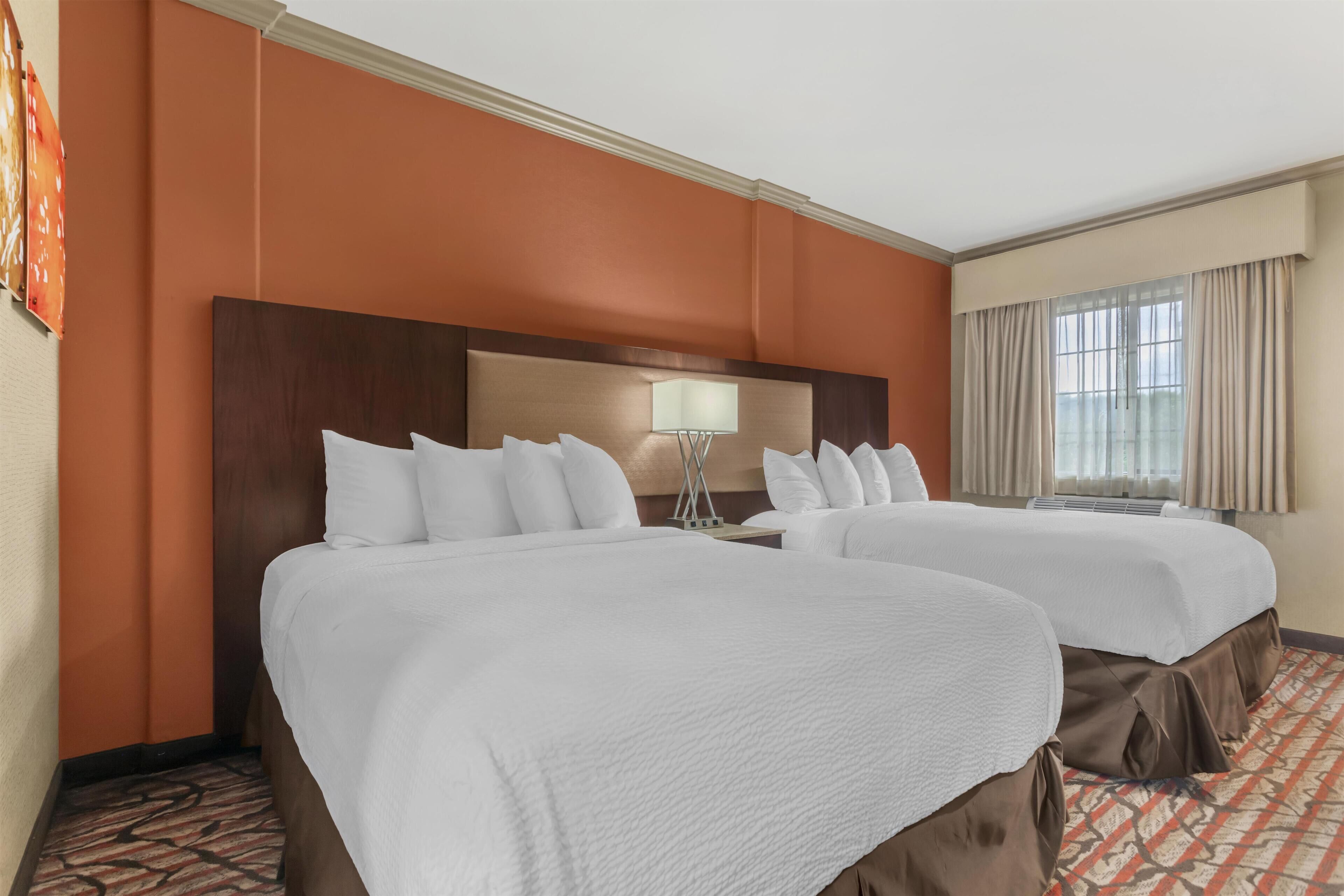 Premium bedding, desk, laptop workspace, iron/ironing board