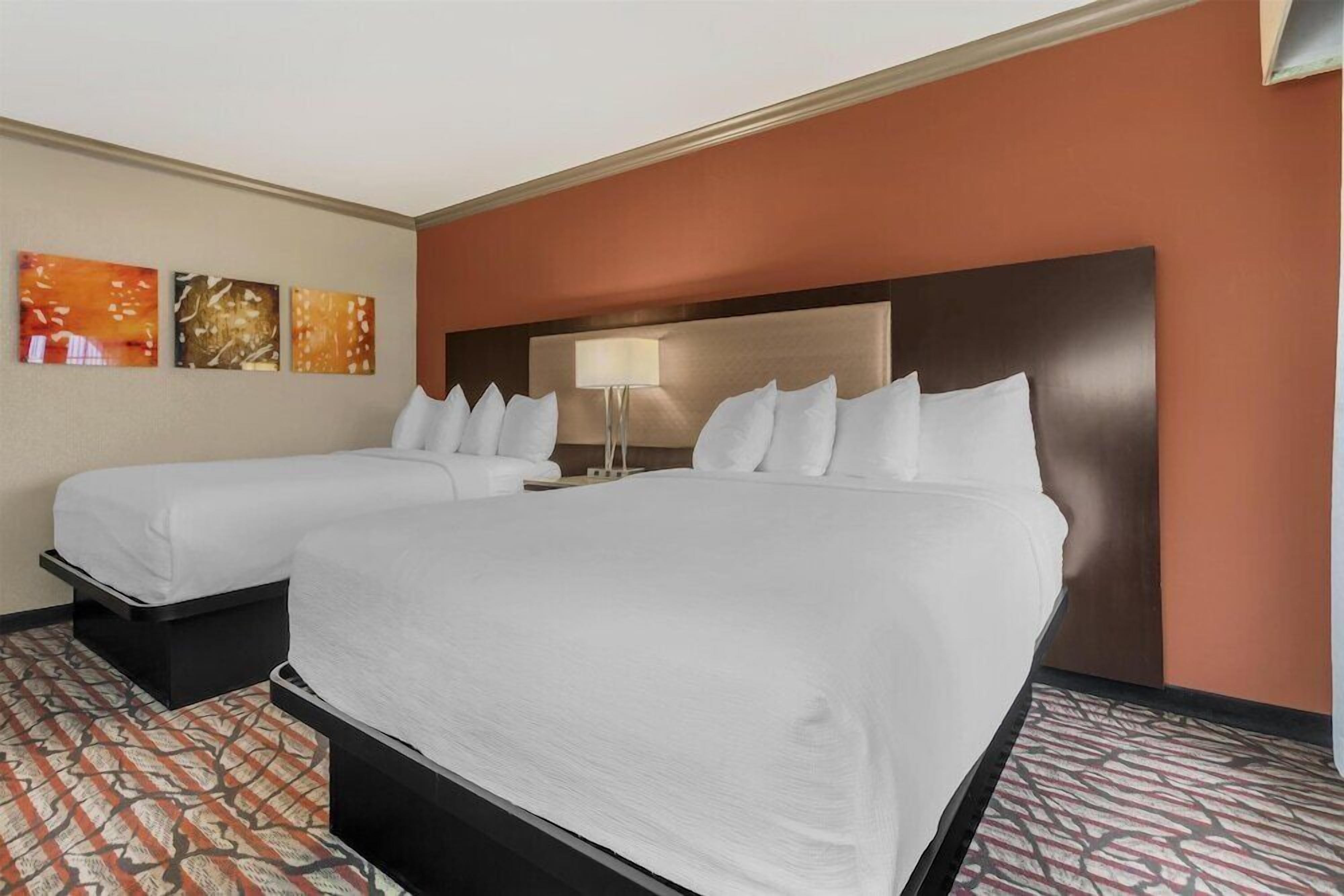 Premium bedding, desk, laptop workspace, iron/ironing board