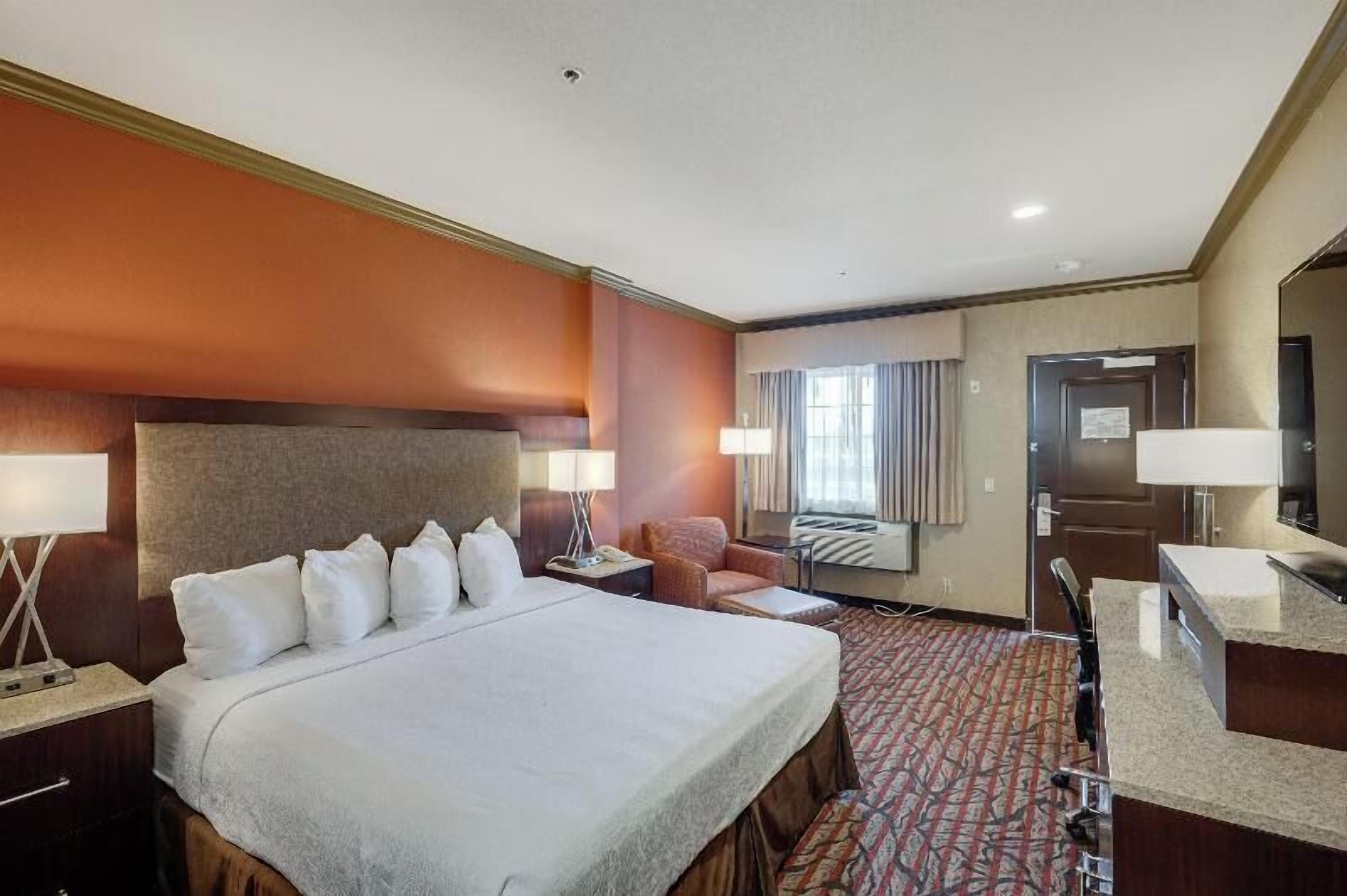 Premium bedding, desk, laptop workspace, iron/ironing board