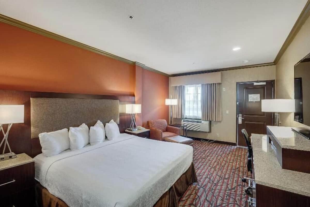 Premium bedding, desk, laptop workspace, iron/ironing board
