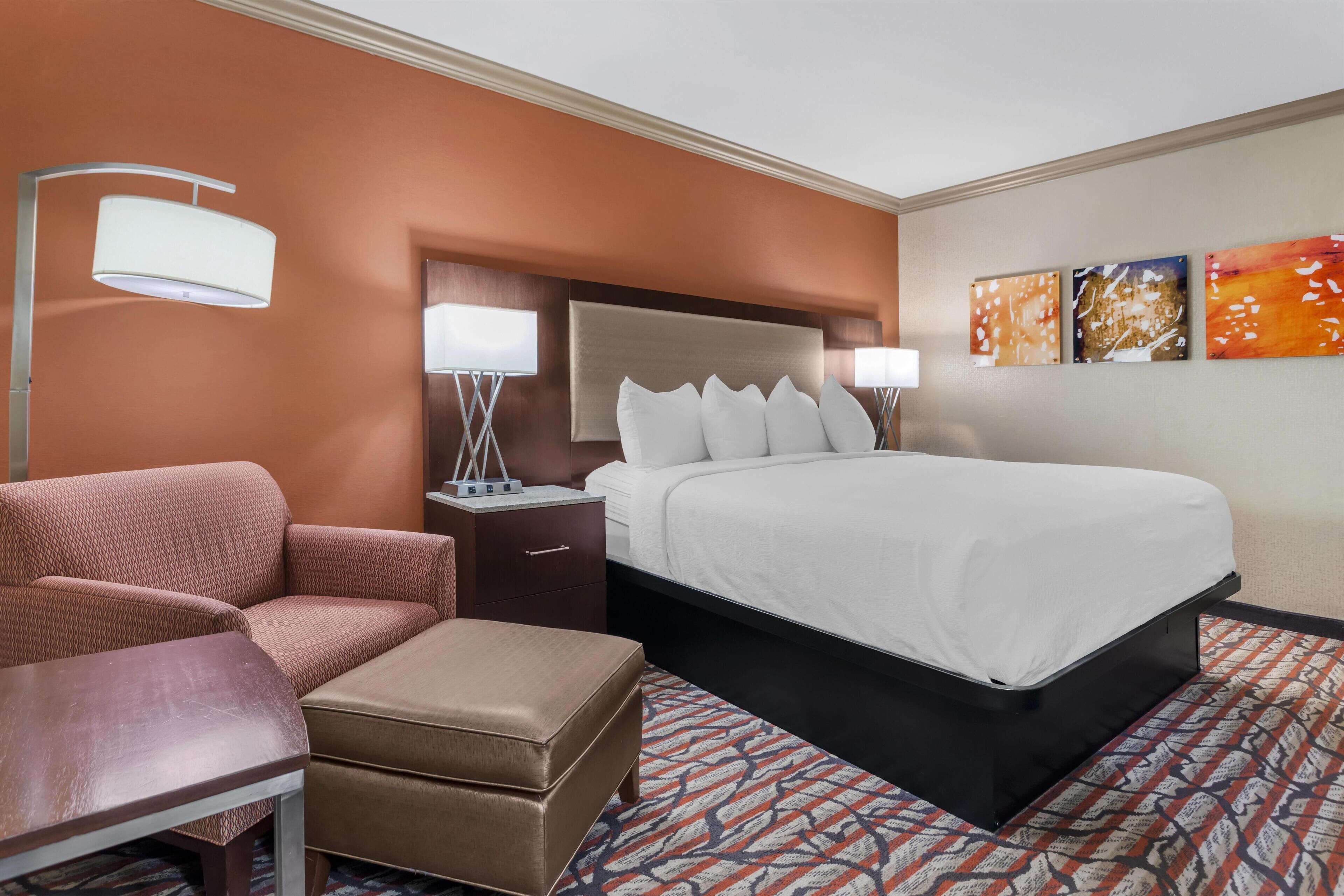 Premium bedding, desk, laptop workspace, iron/ironing board