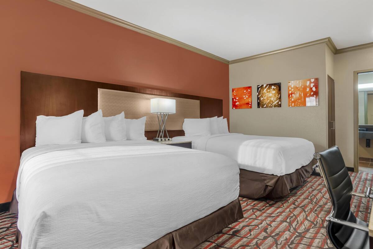 Premium bedding, desk, laptop workspace, iron/ironing board