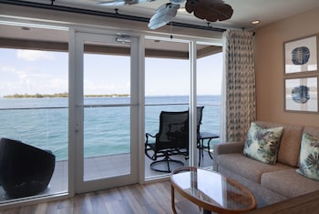 Suite (Dockside) | Living room | 42-inch flat-screen TV with cable channels, TV at Pier House Resort & Spa