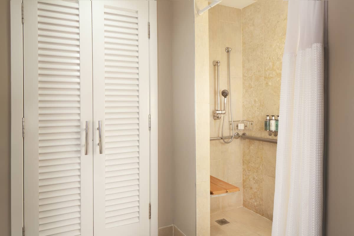 Shower, designer toiletries, hair dryer, bathrobes