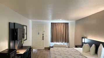 Desk, laptop workspace, iron/ironing board, free cribs/infant beds