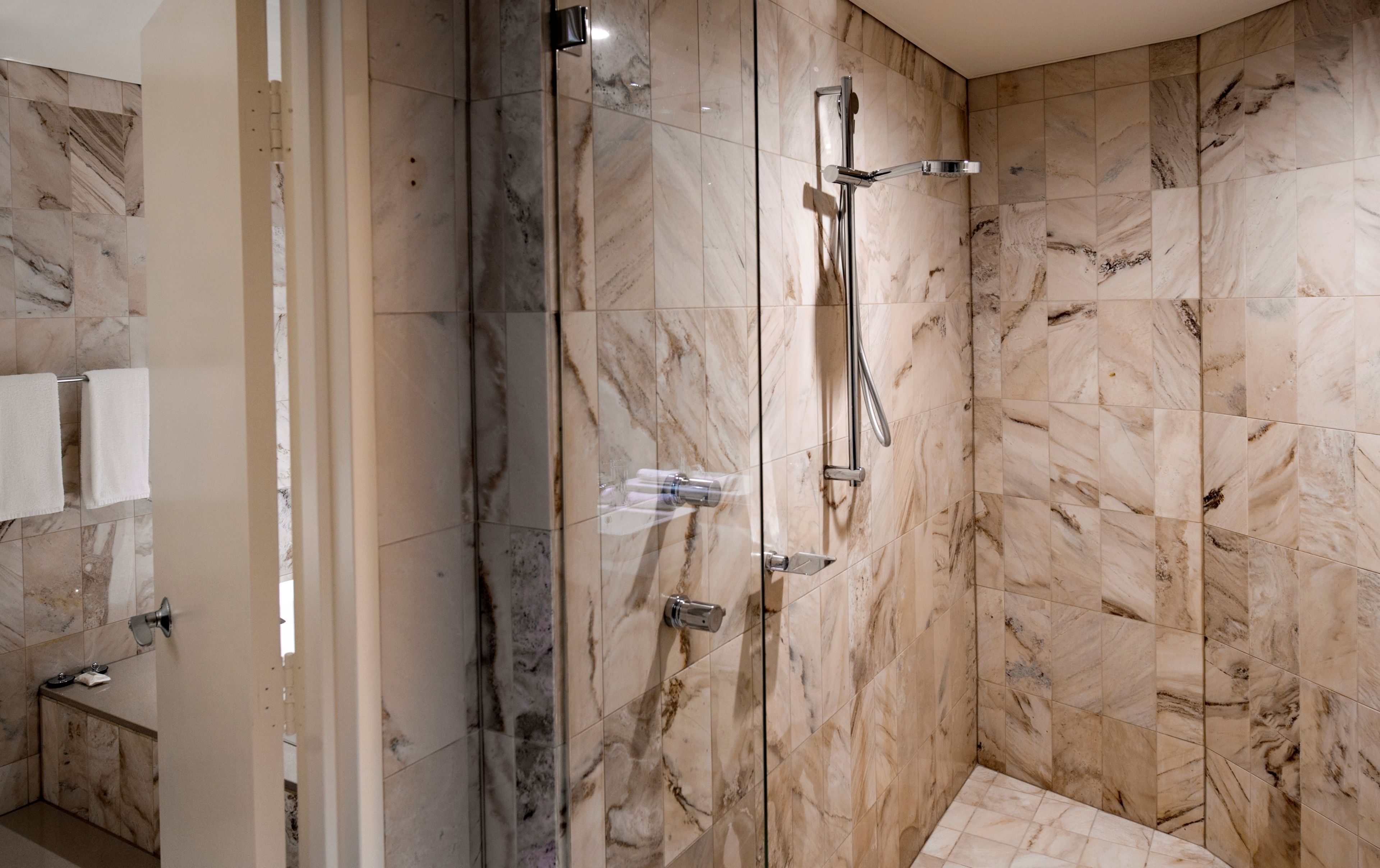 king premier suite | bathroom | shower, free toiletries, hair dryer, towels