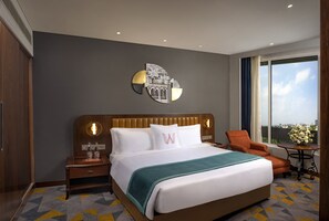 Suite, 1 queensize bed, uitzicht op de stad (Executive Suite) | Luxe beddengoed, een minibar, een kluis op de kamer