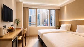 Standard Twin Room | Minibar, in-room safe, desk, blackout drapes