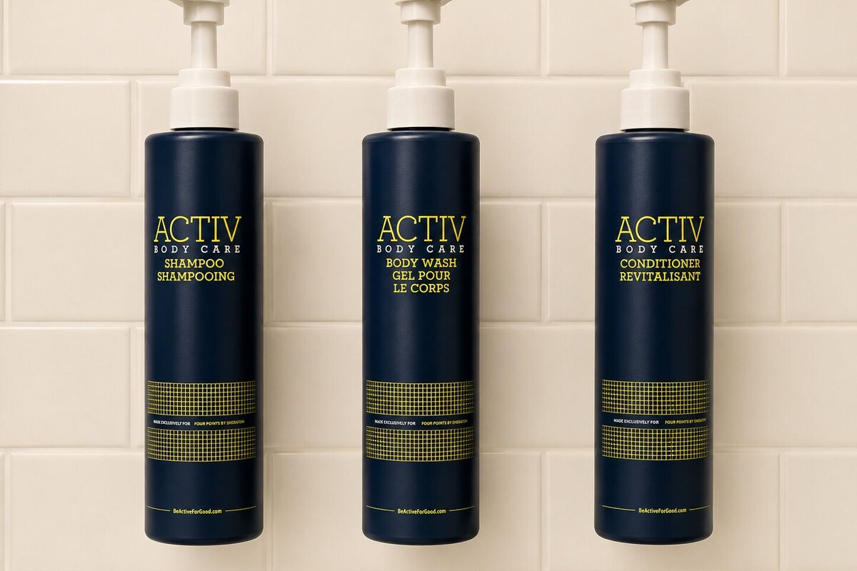 Three bottles of ACTIV body care products against a tiled wall.